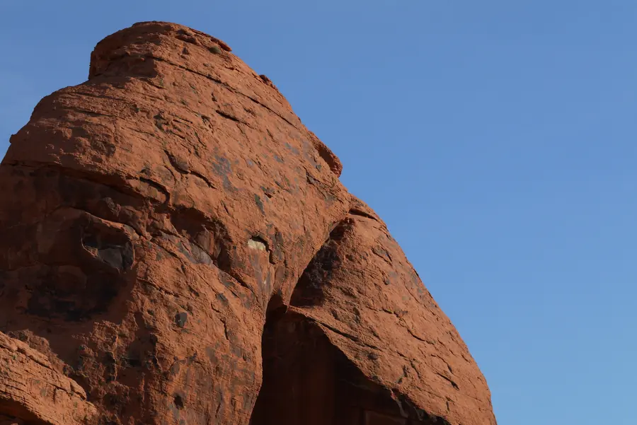 A photo of a rounded red sandstone dome against a clear blue sky at Valley of Fire State Park